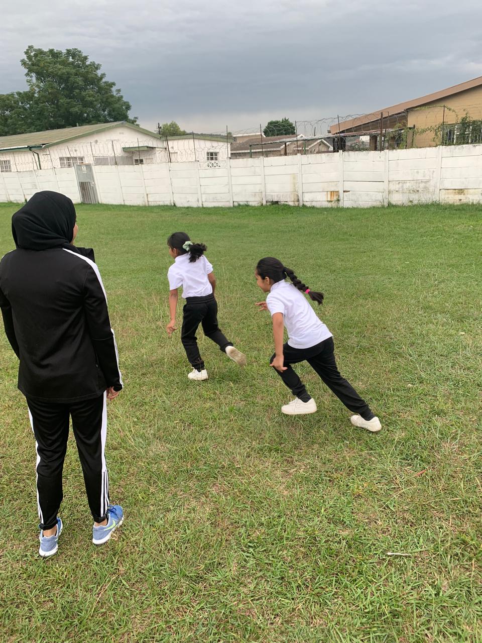 Learners playing outside on a field