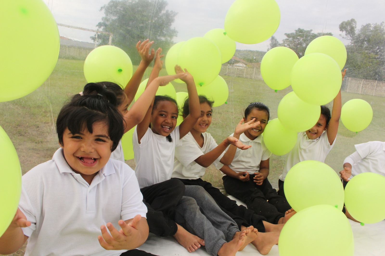 Olive River Schools learners celebrating with balloons